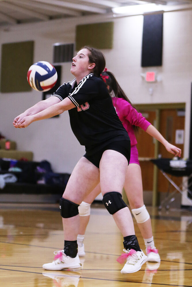 Jamie Tucker receives a serve during the third set against Douglas